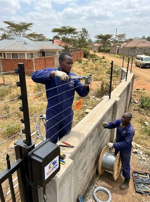Electric fence installation securing a perimeter in Kenya